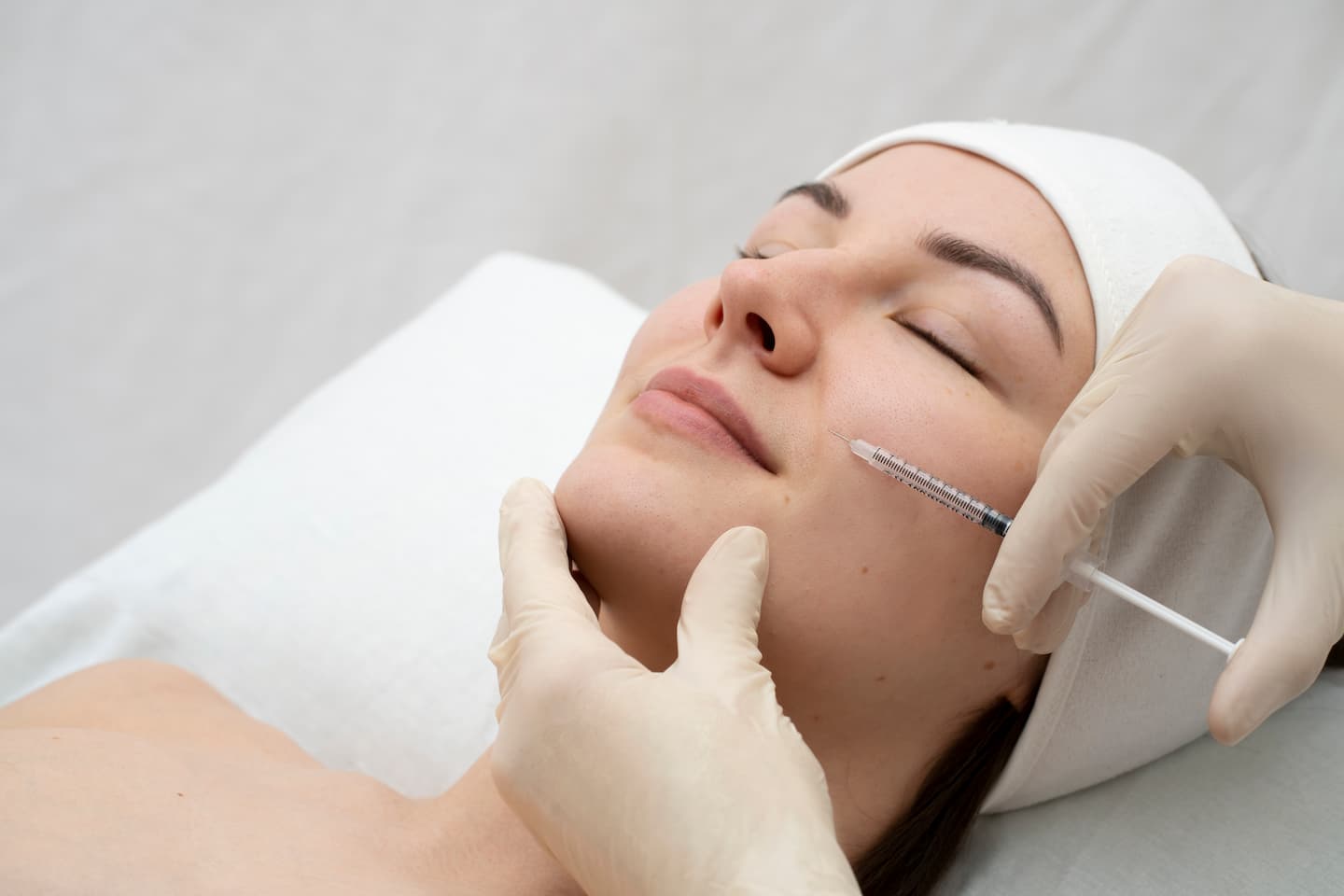 close up woman lip filler procedure 1 Juvederm Juvederm,facial elements,skin treatments near me,skin treatments for wrinkles,Facial volume restoration Airport Plaza Spine and Wellness