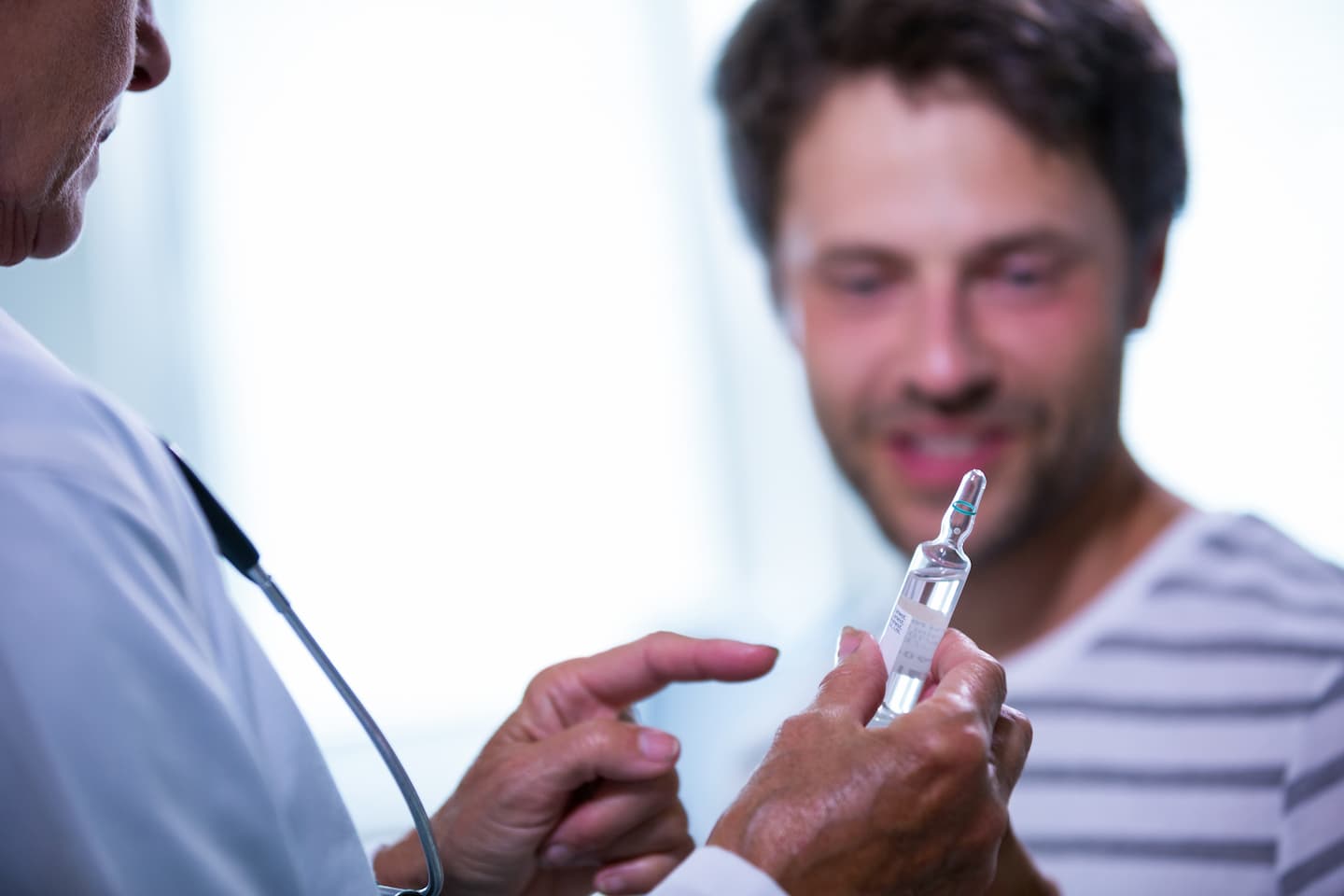 doctor showing injection patient 1 Bio-Identical Hormone Bio-Identical Hormone,Expert Chiropractor in Hazlet,Chiropractic Care,BHRT near me,Natural hormone replacement Airport Plaza Spine and Wellness