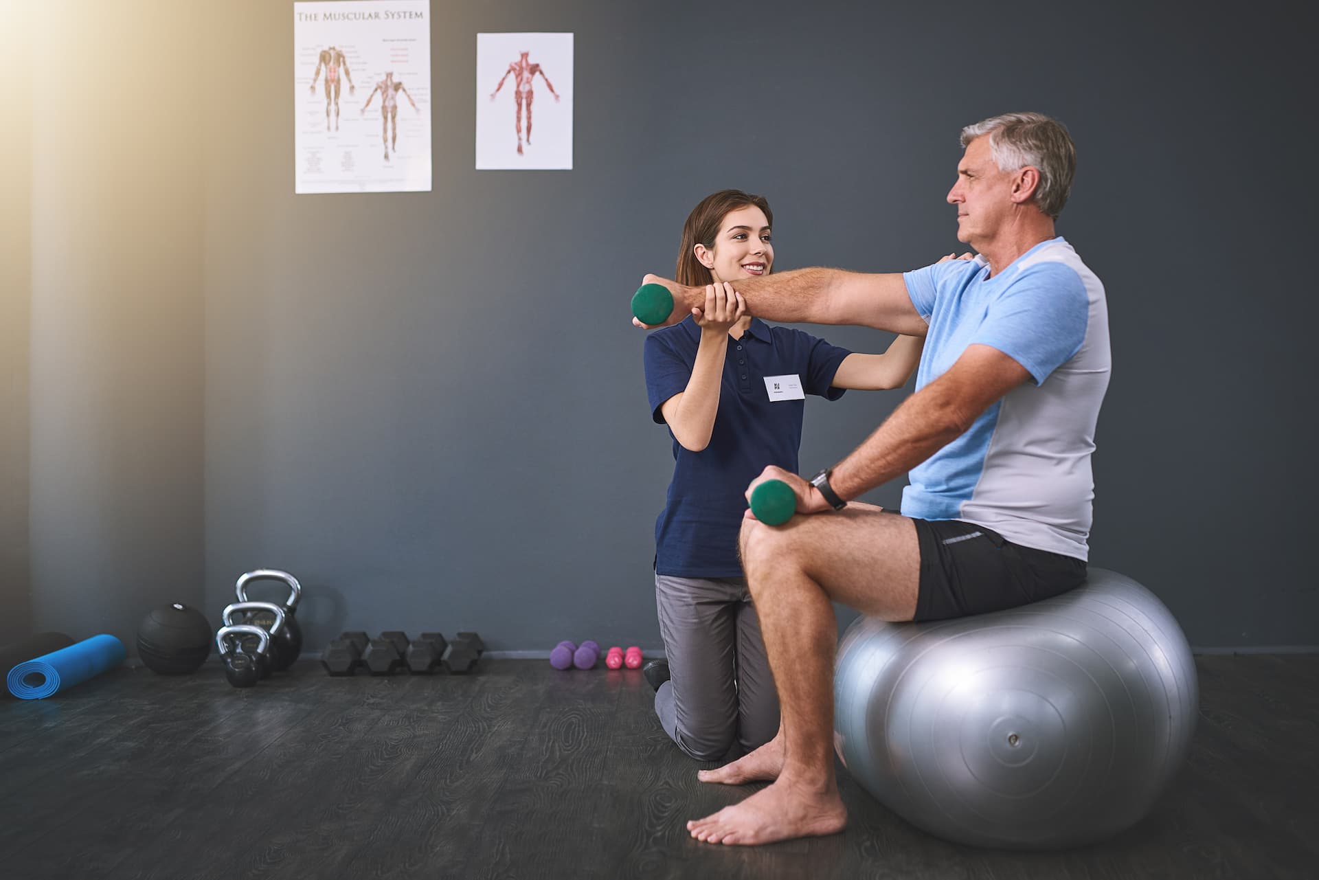 there-you-go-full-length-shot-female-physician-working-with-senior-male-patient-2.jpg